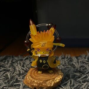 Yellow and Black Anime-Inspired Figurine